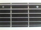 Washburn XB600, a six string bass fingerboard.