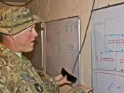 U.S. Army Sgt. Christian Kapler, an infantryman from Oelwein, Iowa, from Company B, 1st Battalion, 133rd Infantry Battalion, shows the dry-erase board he draws out projects for his crew of 44 local national Afghan workers to construct March 5 at Forward O