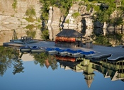 View of the floating dock against reflection of Shawangunk Conglomerate cliff at Mohonk Mountain House