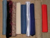 A variety of contemporary fabrics. From the left: evenweave cotton, velvet, printed cotton, calico, felt, satin, silk, hessian, polycotton.
