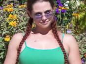 A women with braided pigtails. This photo was taken at a pro-Marijuana rally outside City Hall in Calgary, Alberta, Canada.