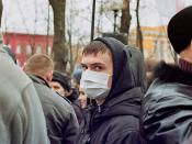 A masked rioter