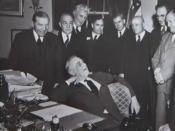 English: Franklin Delano Roosevelt and smiling staff.(after signing the declaration of war with Japan).