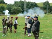 English: Practising their skill with arms Border Loons practise their skills with bow and musket.