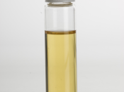 English: Ylang ylang (Cananga odorata) Essential Oil in clear glass vial