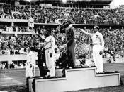 African-American Jesse Owens on the podium after winning the long jump at the 1936 Summer Olympics