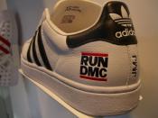 The Adidas shoe with the logotype ogа the hip-hop band Run DMC