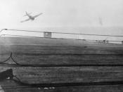 English: October 25, 1944: Kamikaze pilot in a Mitsubishi Zero A6M5 Model 52 crash dives on escort carrier USS White Plains (CVE-66). The aircraft is missing the flight deck and impacts the water just off the port quarter of the ship a few seconds later.