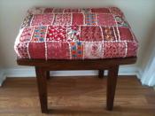 English: Decorative Indian-style quilt textile upholstery on wooden stool