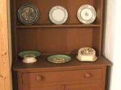 English: A Welsh dresser, with plates, on display in Bedford Museum.