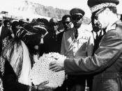 Photo of Shah distributing land deeds.