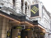 English: A picture of the Noel Coward Theatre displaying signs for its production, Enron
