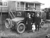 John Schafer with wife Neta Smith Schafer and daughter Bernice beside 1922 Buick Six automobile at railroad logging camp