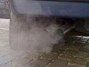 English: Automobile exhaust gas. White exhaust gas is mostly water vapor. Black smoke could come from oil burning.