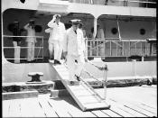 Captain P C Adelus of the Marine Nationale disembarking FR AMIRAL CHARNER