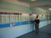 English: In front of the class schedule board on the 2nd floor of the 