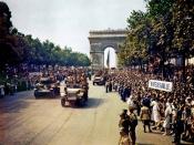 Crowds of French patriots line the Champs Elysees to view Free French tanks and half tracks of General Leclerc's 2nd Armored Division passes through the Arc du Triomphe, after Paris was liberated on August 26, 1944.