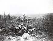 English: Canadian machine gunners dig themselves in, in shell holes on Vimy Ridge. This shows squads of machine gunners operating from shell-craters in support of the infantry on the plateau above the ridge.