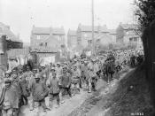 English: German prisoners of war on the march to confinement areas behind the Canadian lines.