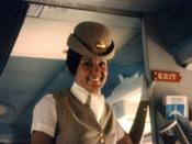 Pan-Am flight attendant on airplane. Photo taken during the summer of 1970