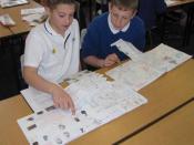 Two students share and compare their learning logs.