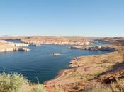This is the southwestern portion of Lake Powell, which lies in Arizona. The back of Glen Canyon dam can be seen to the right in this image.