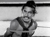 English: Japanese actor Toshirō Mifune as bandit Tajōmaru in Rashomon 1950 film 日本語: 三船 敏郎 Česky: Toširó Mifune