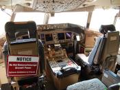 Boeing 777 cockpit, note software update in progress...