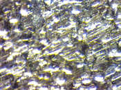 English: Mild steel sheet metal close-up view. Deutsch: Wald- und Wiesenstahlblech Mikroskopansicht.