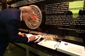 English: Arlington, Va. (Aug. 11, 2003) -- National Football League (NFL) Hall of Fame quarterback, Terry Bradshaw signs the guest book at the 911 Memorial for America's Heroes inside the Pentagon. The Fitz-Bradshaw NASCAR Busch Race Team owned by Terry B