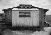 English: Front of the , located off in Grassy Butte, , . Built in 1914, the post office is listed on the .