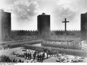 Hindenburg's original 1934 burial at the Tannenberg Memorial. Hitler is speaking at the lectern.