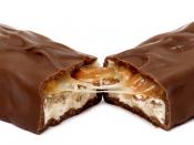 English: A Snickers candy bar, broken in half.