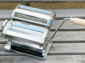 This is a hand powered pasta making machine.