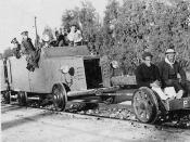 English: A British armored railroad wagon behind a railcar on which two Arab hostages are seated, 1936-1939 Arab Revolt