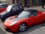 English: A Tesla Roadster, Reva i and Ford Th!nk electric cars parked at a free parking and charging station near Akershus fortress in Oslo, Norway