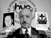Nazi hunter Simon Wiesenthal holding a picture of Nazi war criminal, Walter Rauff, in May 1973.