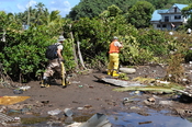 English: Leone, AS, October 2, 2009 -- Members the Hawaii National Guard, Civil Support Team, search for hazardous waste. The collection of hazardous waste is an important step in the removal of debris after a tsunami disaster.