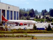 777 rolled out at Boeing factory.