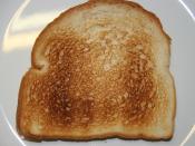 English: Two slices of electrically toasted white bread on a white plate