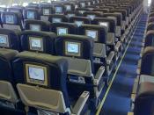 English: Economy class cabin interior of a Thomas Cook Airlines Airbus A330.
