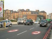 In London, street markings and a sign (inset) with the white-on-red C alert drivers to the charge.