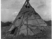 English: Photograph shows reed mat covered tepee in grassy field, Washington. Yakima.