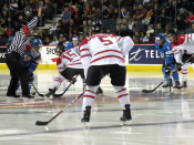 English: The Canadian and Finnish junior teams face off during an exhibition game in Calgary, Alberta.