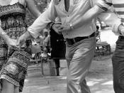 Secretary of State George Firestone (center), Florida Folklife Program director Phillip A. Werndli and Patti Schutt dancing with the Drava Folkdance Ensemble at the 1980 Florida Folk Festival: White Springs, Florida