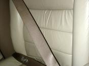 A three point seat belt in a Lincoln Town Car.