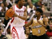 of the Houston Rockets, being guarded by of the Washington Wizards