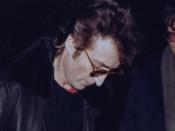 Lennon signing Chapman's Double Fantasy album a few hours before the shooting