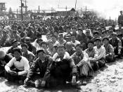 At the United Nations' prisoner-of-war camp at Pusan, prisoners are assembled in one of the camp compounds. The camp contains both North Korean and Chinese Communist prisoners. ID #HD-SN-99-03037