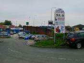 English: Car sales business beside Wilderspool Bridge